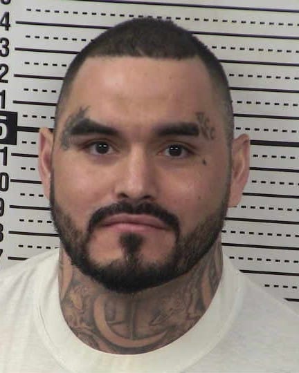 Mugshot of Jaime Lopez, 35, showing head and shoulders in front of a height chart.