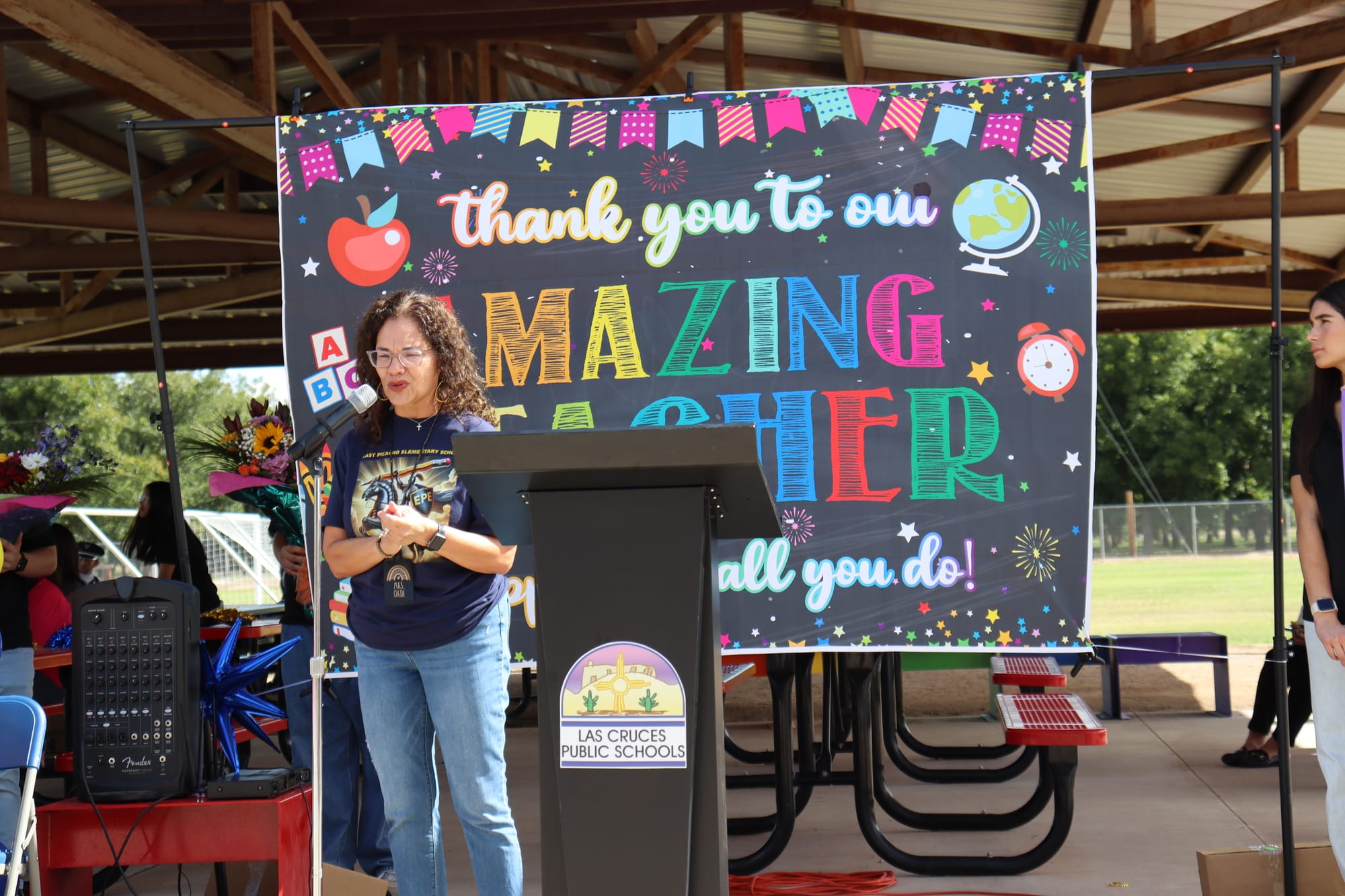 Nancy Orta speaks at a podium Sept. 29 at East Picacho Elementary in Las Cruces after being named the 2026 New Mexico Teacher of the Year.