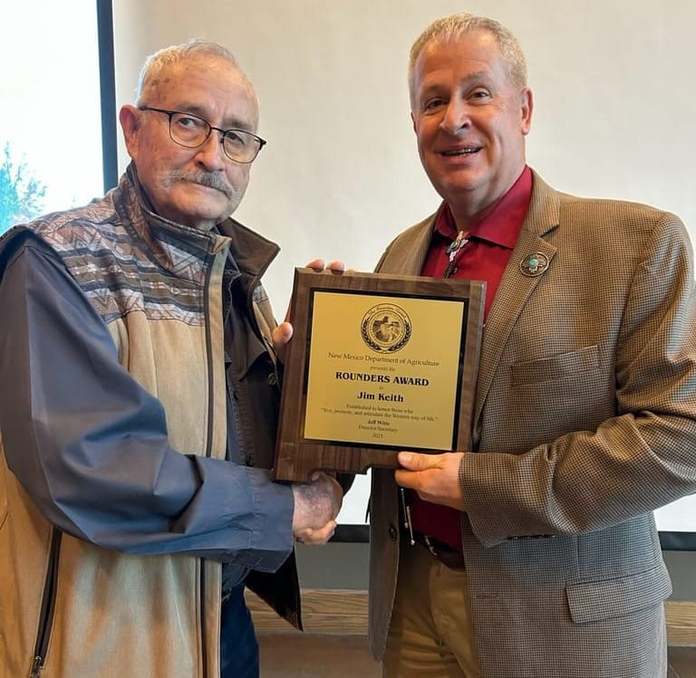 New Mexico Agriculture Secretary Jeff Witte, right, presents the 2025 Rounders Award plaque to farrier and artist Jim Keith during a ceremony at the New Mexico Farm and Ranch Heritage Museum.