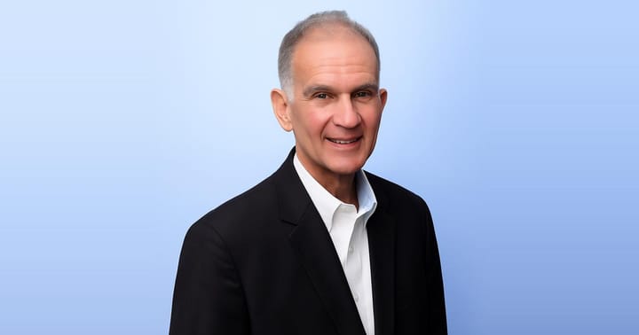 Greg Repetti, interim CEO of MountainView Regional Medical Center, smiles in a professional headshot with a soft gradient background.