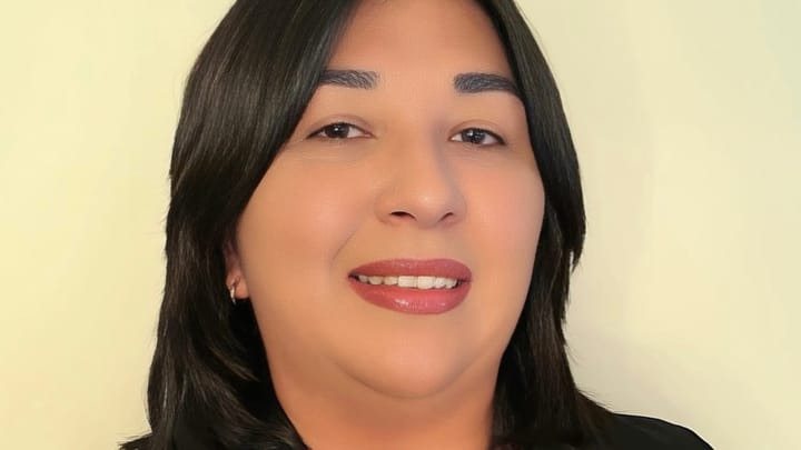 Denisse Carter, newly appointed Economic Development Director for Doña Ana County, wearing a black blazer against a light background.