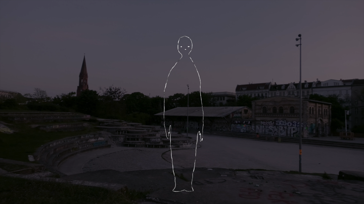 A faint white outline of a human figure appears over a dim urban park at dusk, with graffiti-covered structures and a tall church steeple in the background.