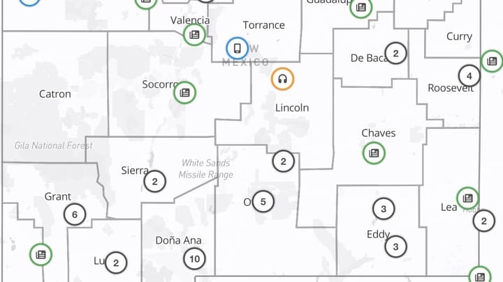 A statewide map of New Mexico showing county boundaries marked with icons and numbers that indicate the distribution of local news outlets across the state.