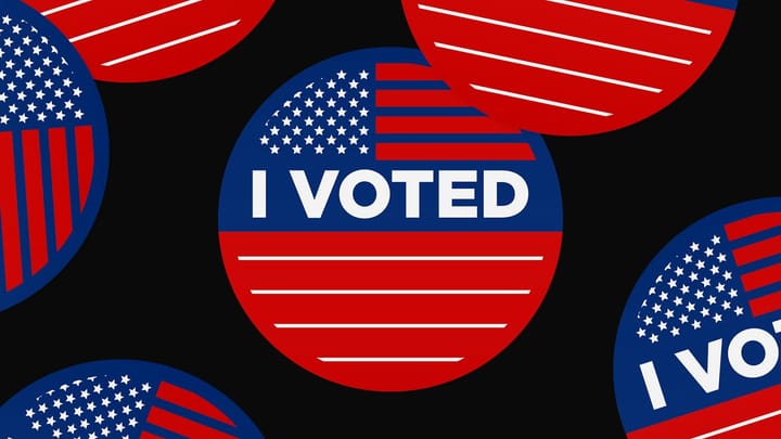 Red, white and blue “I Voted” stickers with stylized American flag designs scattered across a black background.