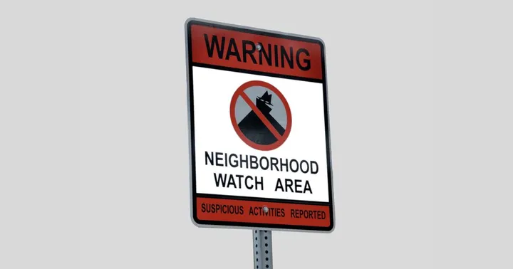 A red-and-white “Warning: Neighborhood Watch Area” sign with a crossed-out silhouette of a suspicious figure in a hat, against a plain light gray background.