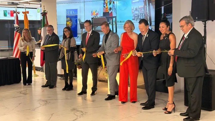 Officials from New Mexico and Mexico cut a yellow ribbon during the opening of New Mexico’s new Economic Development and Tourism office in Mexico City.