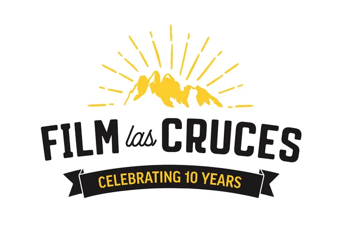 Film Las Cruces 10th-anniversary logo: yellow Organ Mountains with rays above, “Film las Cruces” text, and a black ribbon reading “Celebrating 10 Years” on a white background.