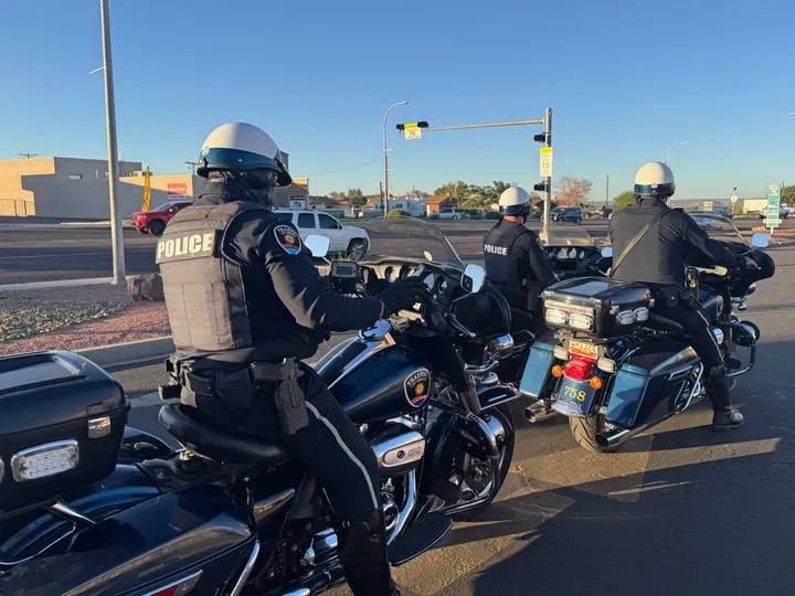 Three Las Cruces police officers on motorcycles prepare to begin a morning traffic enforcement operation on E Lohman Avenue.