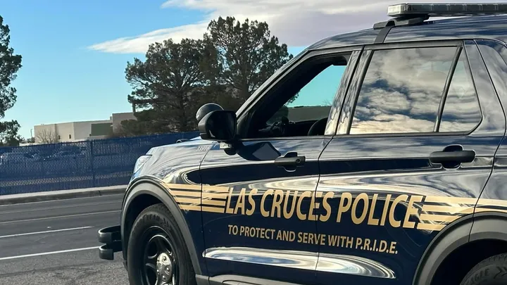 Las Cruces Police Department patrol SUV parked along a roadway, with department name and “To Protect and Serve With P.R.I.D.E.” visible on the side.