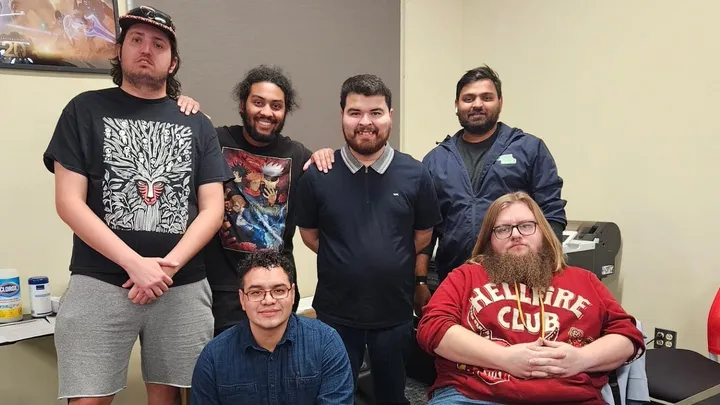 A group of six Doña Ana Community College students pose inside a classroom during the Global Game Jam weekend event.