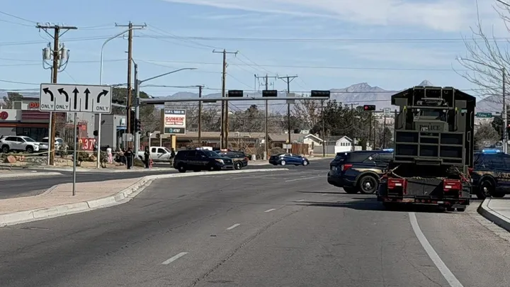 Police vehicles block traffic along South Valley Drive near Avenida de Mesilla as investigators secure the scene of a fatal police shooting Sunday morning in Las Cruces.